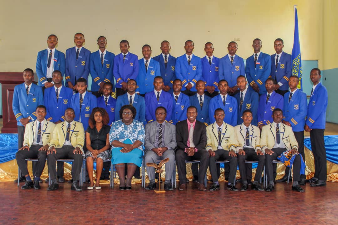 Students and staff group photograph in the hall