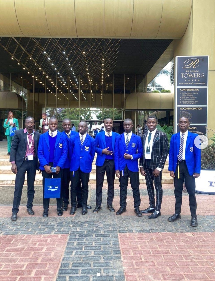 Students and accompanying adults outside the Rainbow Towers